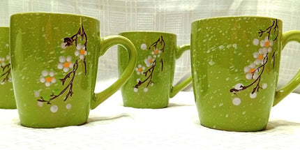 Tazón 500 cl reforzado con mango con motivo floral en colores anaranjados verdes celeste negros